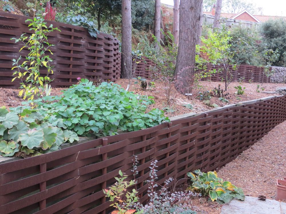woven steel terracing with plants growing